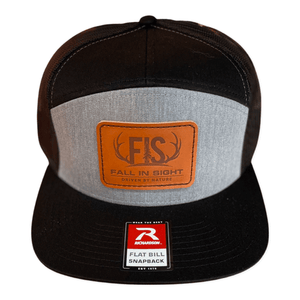 Black and gray seven panel snapback fis hat with a leather fis logo patch on the front