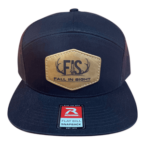 Black seven panel fis hat with a patch made from buffalo hide with and fis logo